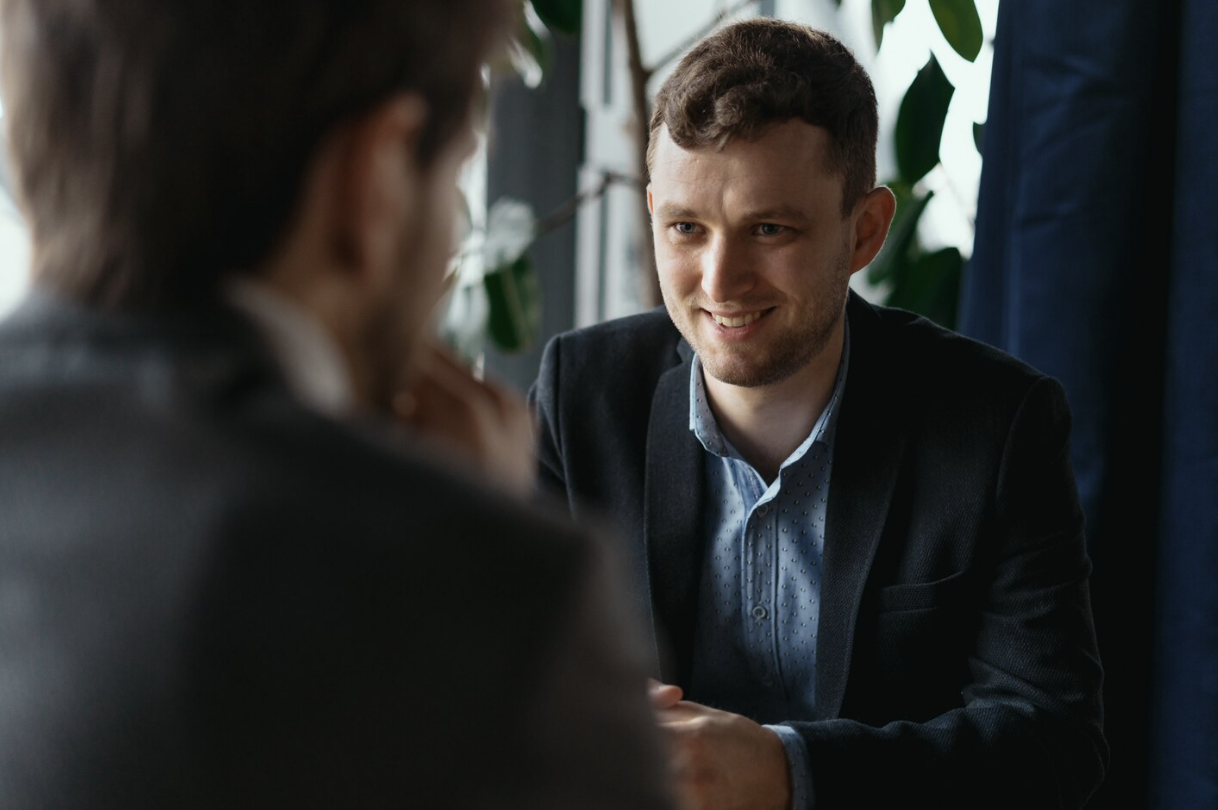Two professionals discussing cryptocurrency investments and institutional digital asset services.