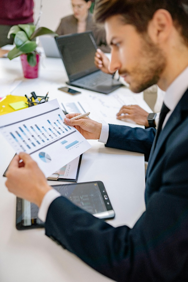 professional reviewing a printed financial chart.