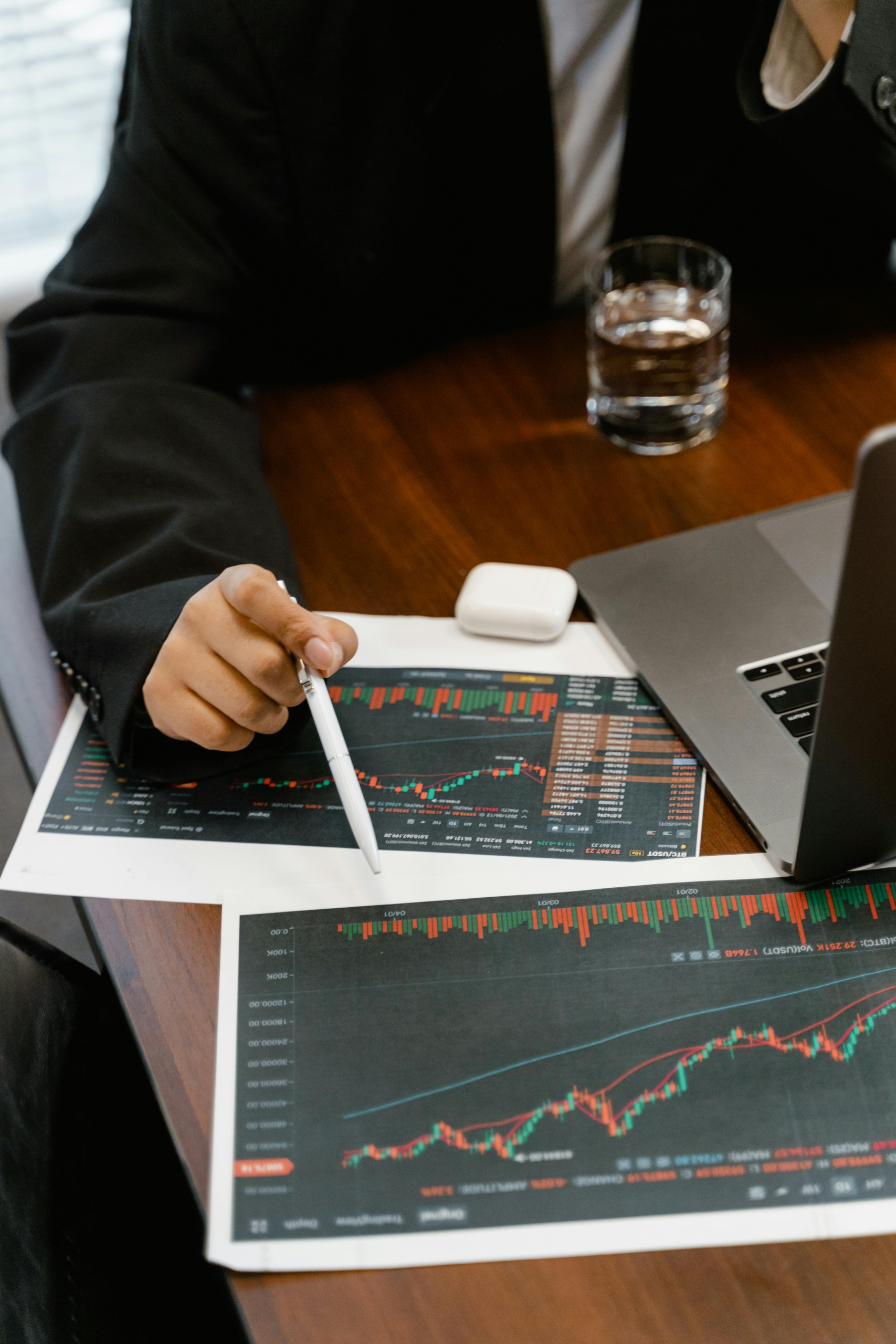 professional reviewing digital asset price charts and market data while analyzing trading activity.