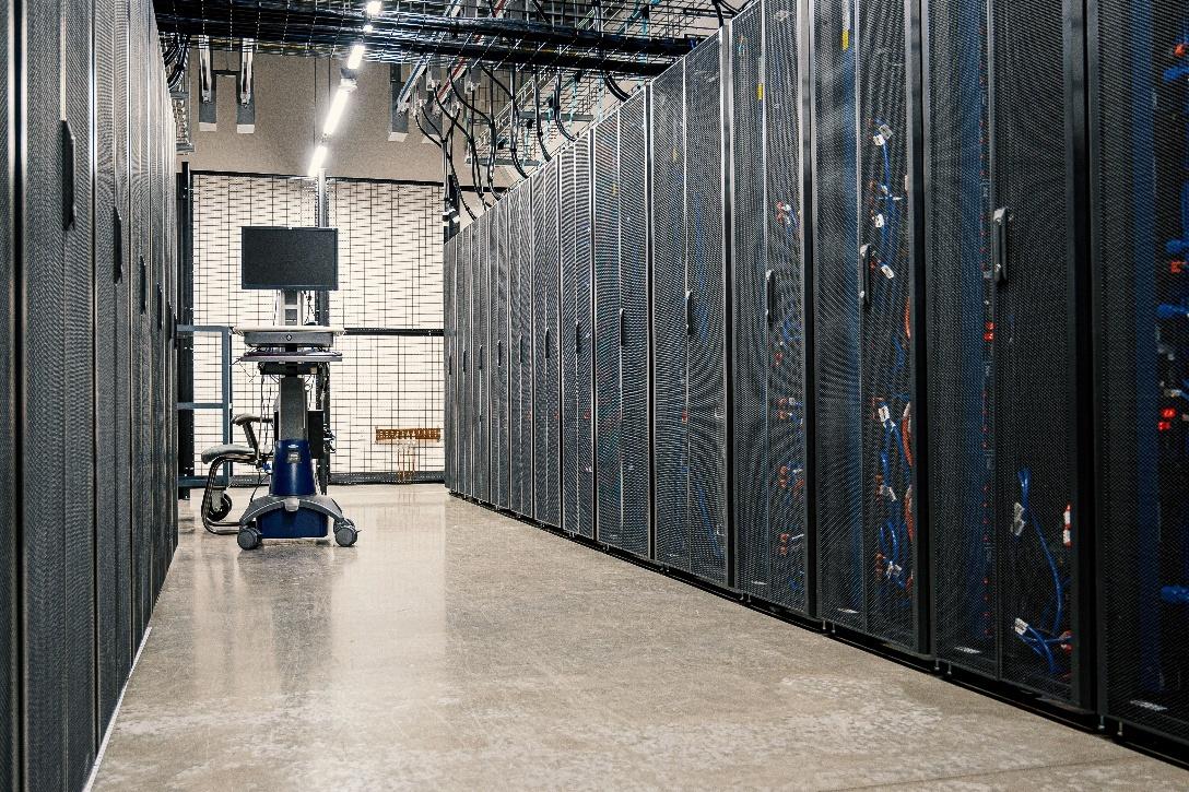 Server racks representing digital ledger infrastructure for tokenized money settlement.