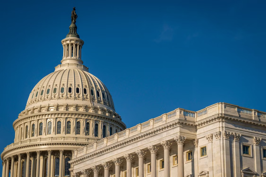 The U.S. Capitol building under a clear sky, associated with pending federal legislation.