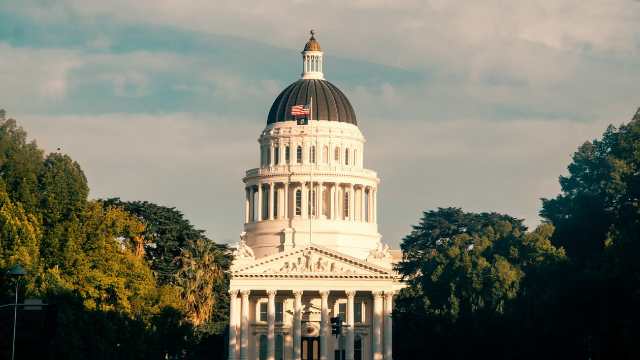 kenson Investments | Understanding California's New Digital Asset Framework: What Market Participants Should Know The California State Capitol building against a blue sky, symbolizing new state-level digital asset legislation.