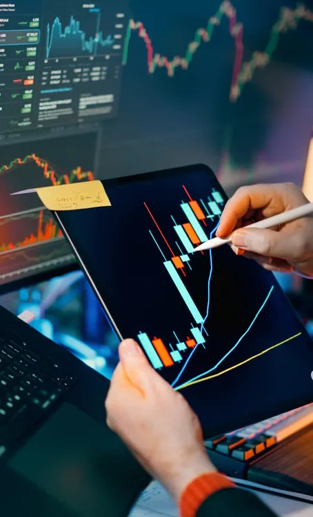 Bitcoin price chart displayed on multiple trading screens during a period of market volatility.