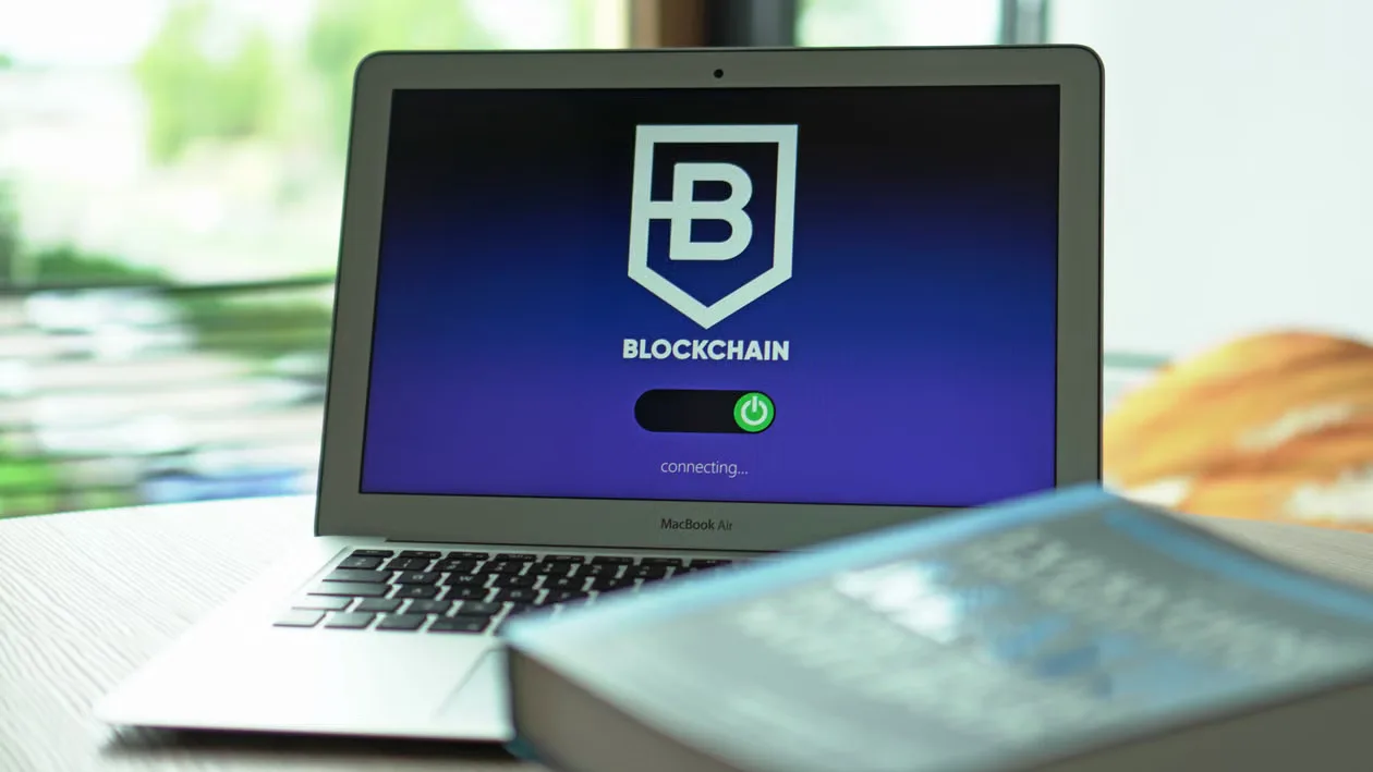 Laptop with blockchain application interface connecting.