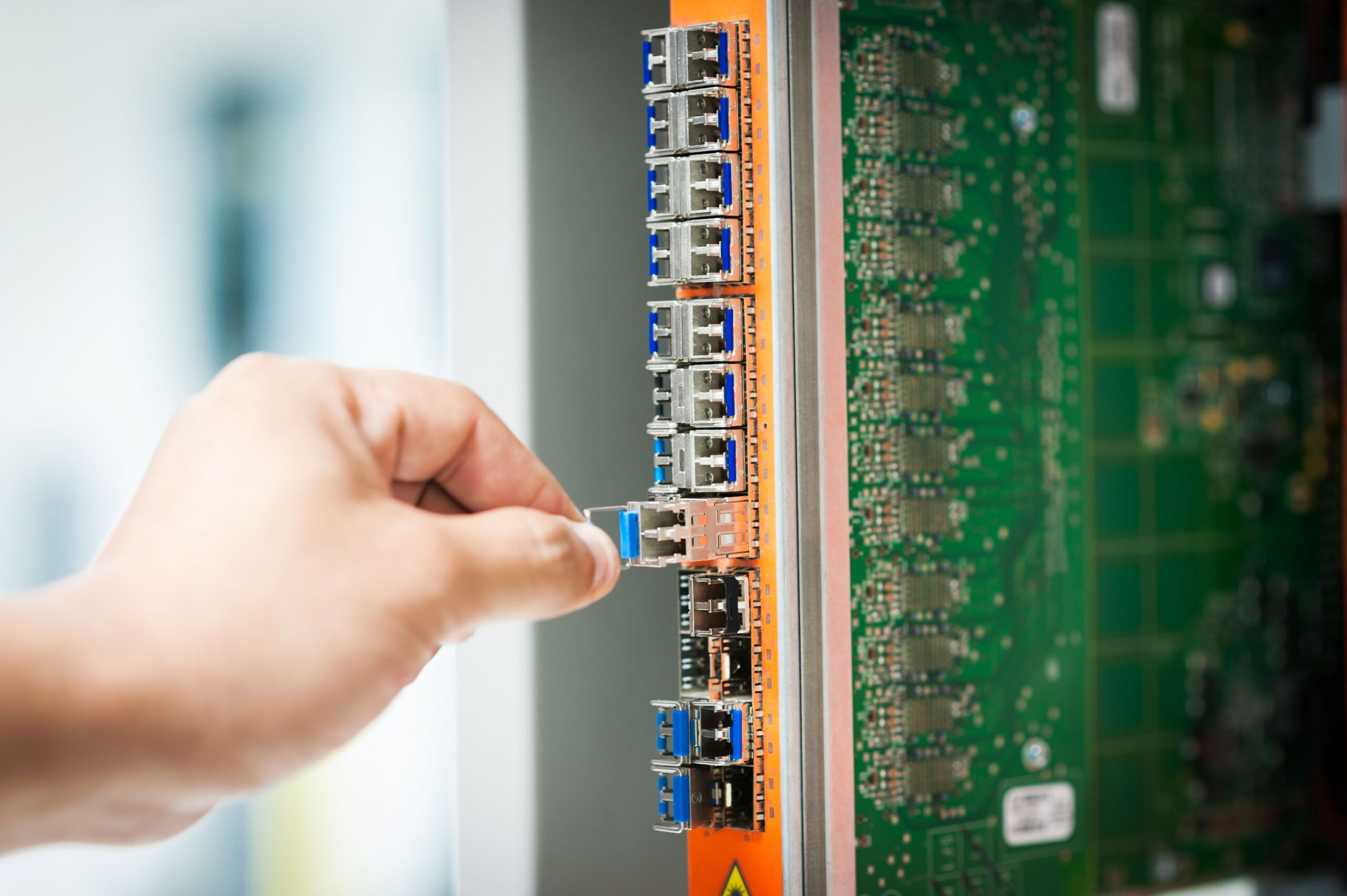 Engineer connecting network infrastructure representing integration between tokenized securities systems and existing post-trade infrastructure