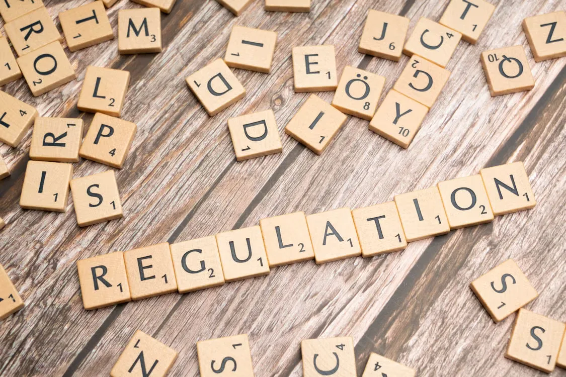 kenson Investments | Regulators Pursue Alternative Paths Following Legislative Delays Wooden letter tiles spelling 'Regulation'