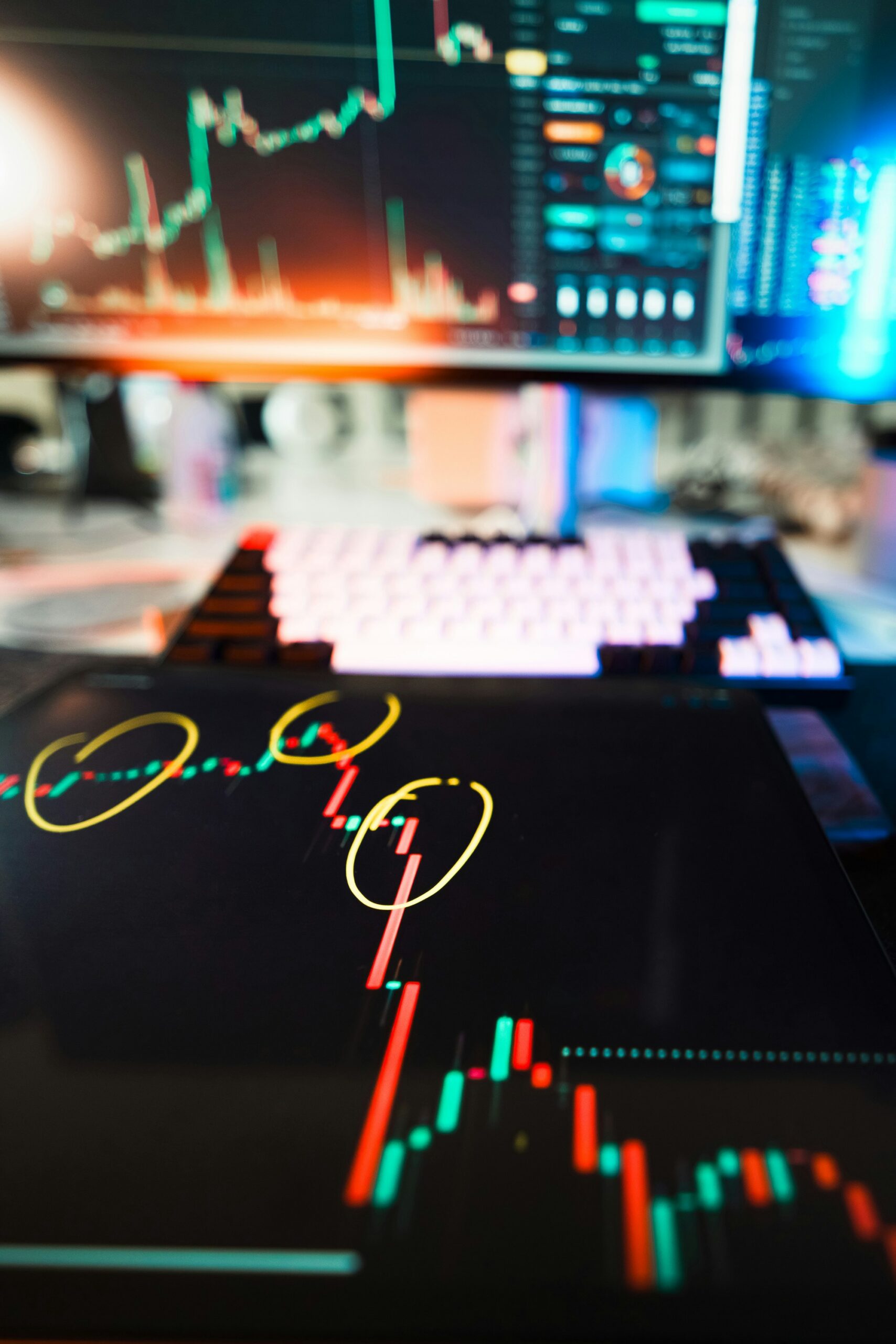 Stock-market charts displayed across digital devices representing the convergence of securities markets and blockchain infrastructure