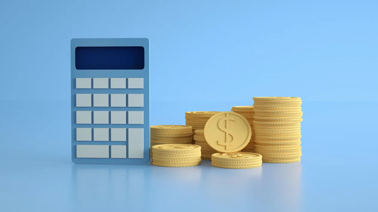 A conceptual image of a calculator with gold coins