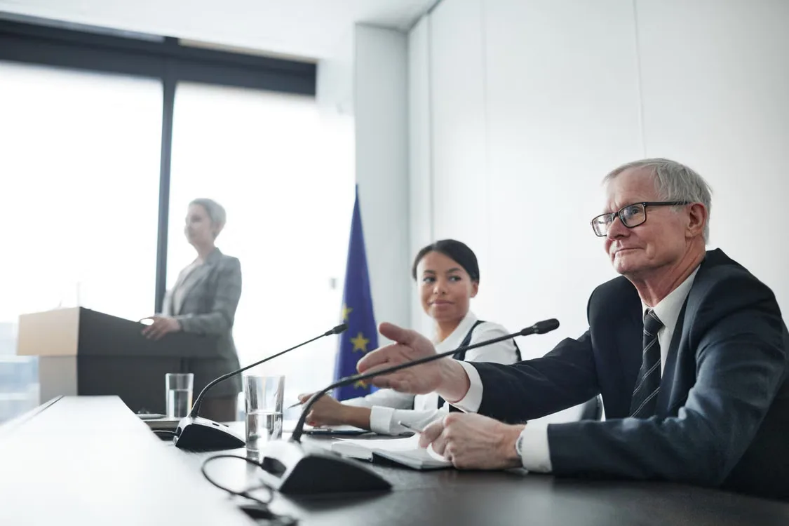 officials participating in a hearing