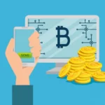 Computer and smartphone displaying Bitcoin symbols for digital asset monitoring.