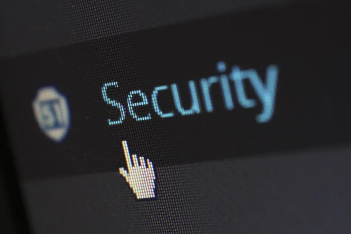 kenson Investments | Blockchain Account Permissions Explained: How Delegated Access Changes Digital Asset Security Close-up view of a mouse cursor over digital security text on display.