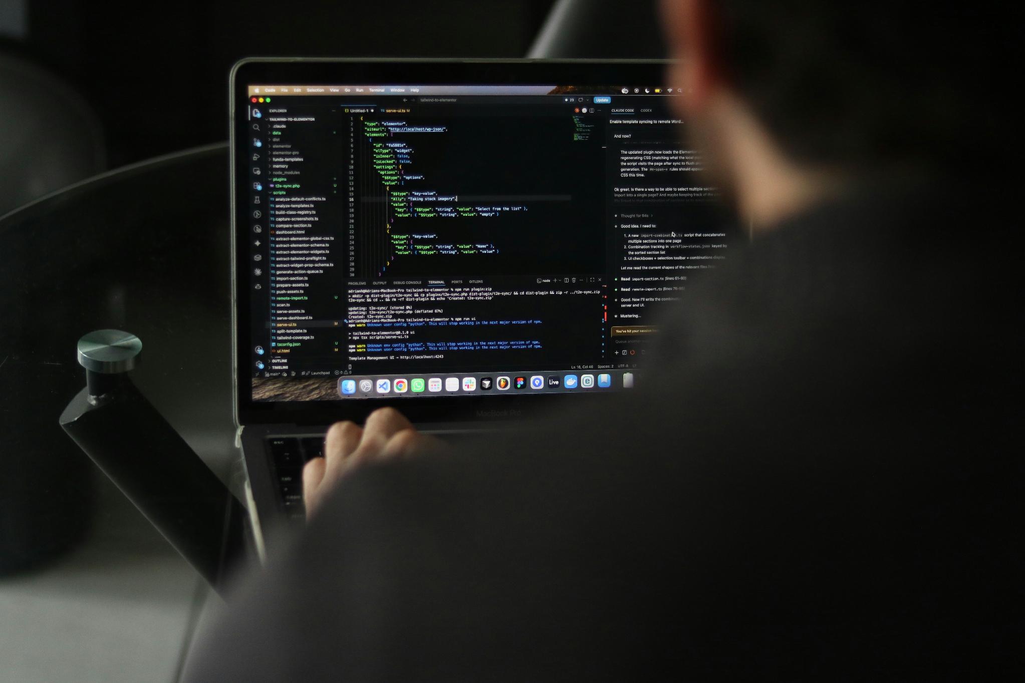Developer working with programming code on a laptop representing blockchain smart contract execution