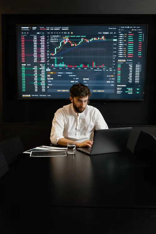 Analyst reviewing digital asset news headlines alongside market sentiment indicators