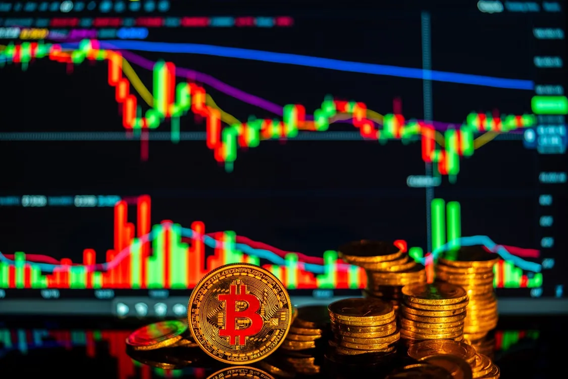 kenson Investments | Crypto Vaults Explained: Five Risks to Understand Before Evaluating Digital Asset Lending Golden bitcoins with financial growth charts illustrating investment opportunities in cryptocurrency.
