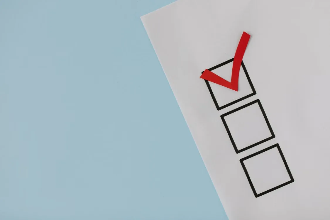A simple white paper checklist with one red checkmark