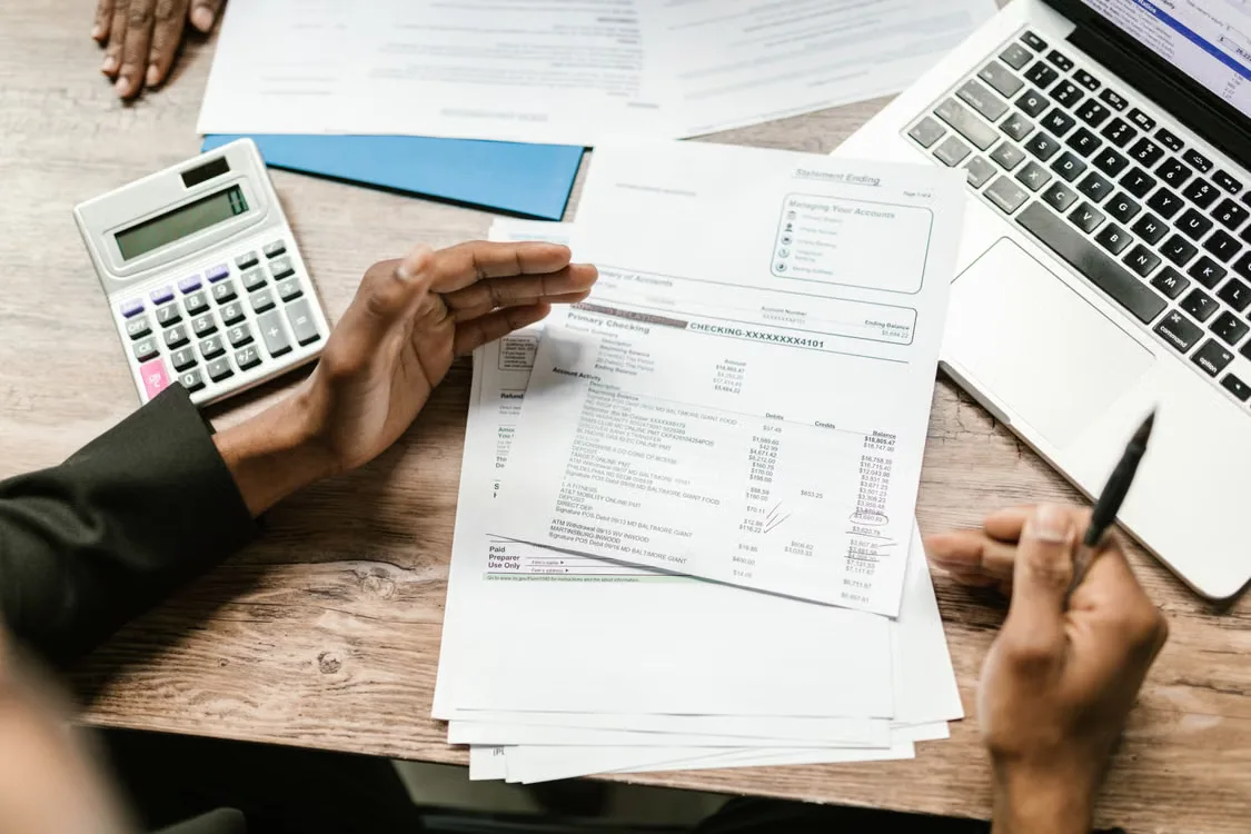 A financial reporting workspace with digital asset transaction records, a contract, and a reconciliation spreadsheet.