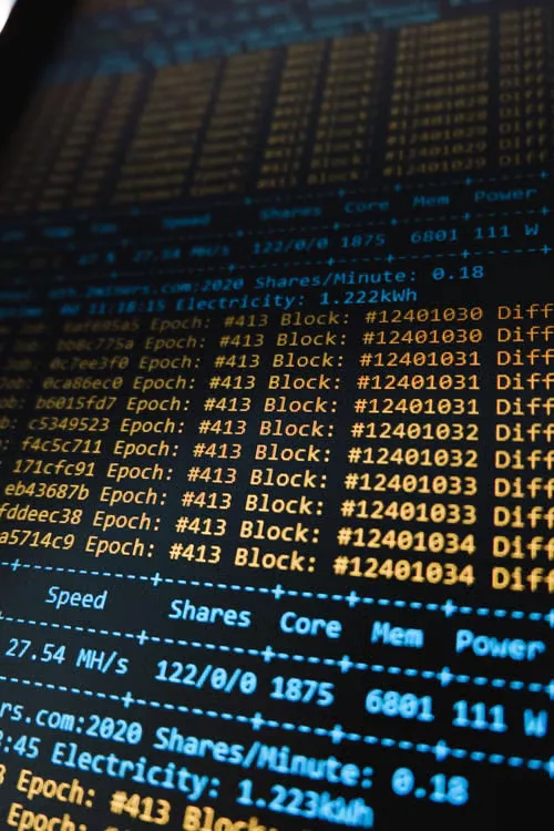 Detailed view of a cryptocurrency mining software interface displaying real-time data on a computer monitor. 