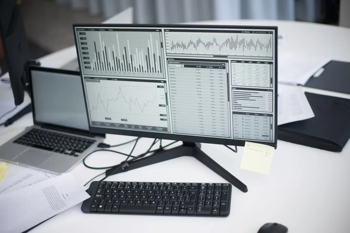 A computer displaying network data and validator status in a technical operations environment.