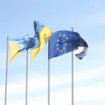 A digital illustration of a stablecoin beside European Union flags