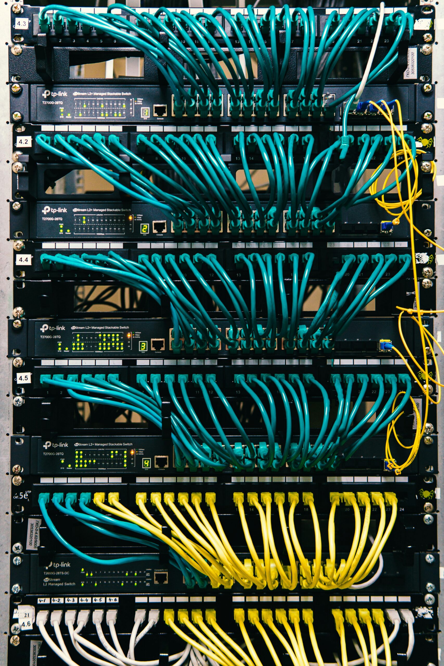 Close-up of server hardware and connected network cables in a protected computing environment