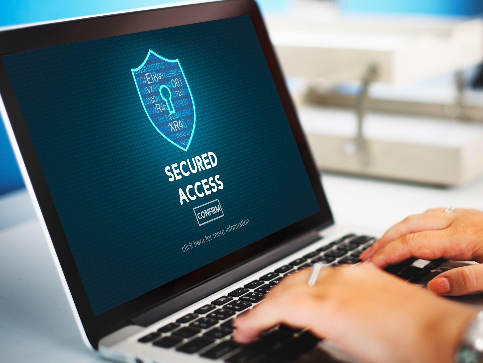 Secured laptop access screen representing signer replacement, credential updates, and digital asset access control.