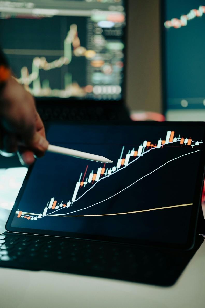 Analyst reviewing digital asset market charts and blockchain data across multiple screens.