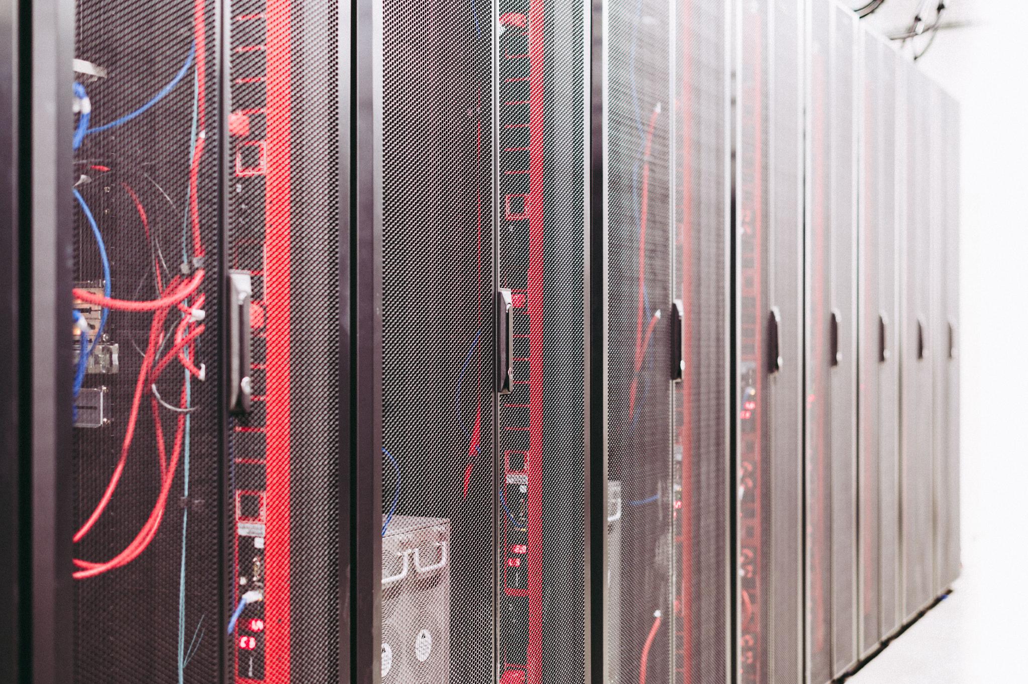 Network cables and server racks inside a data center supporting validator infrastructure