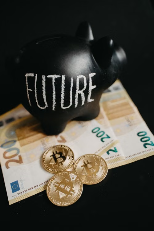 Black piggy bank labeled 'Future' with 200 euro bills and Bitcoin coins